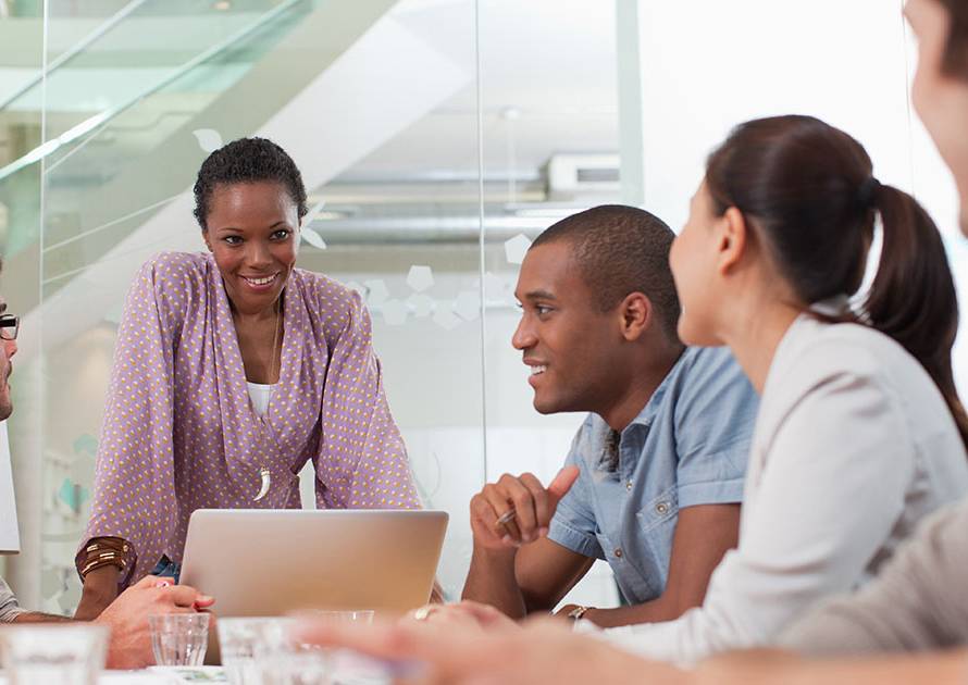 Business owner on a video call with a remote finance team member reviewing financial reports
