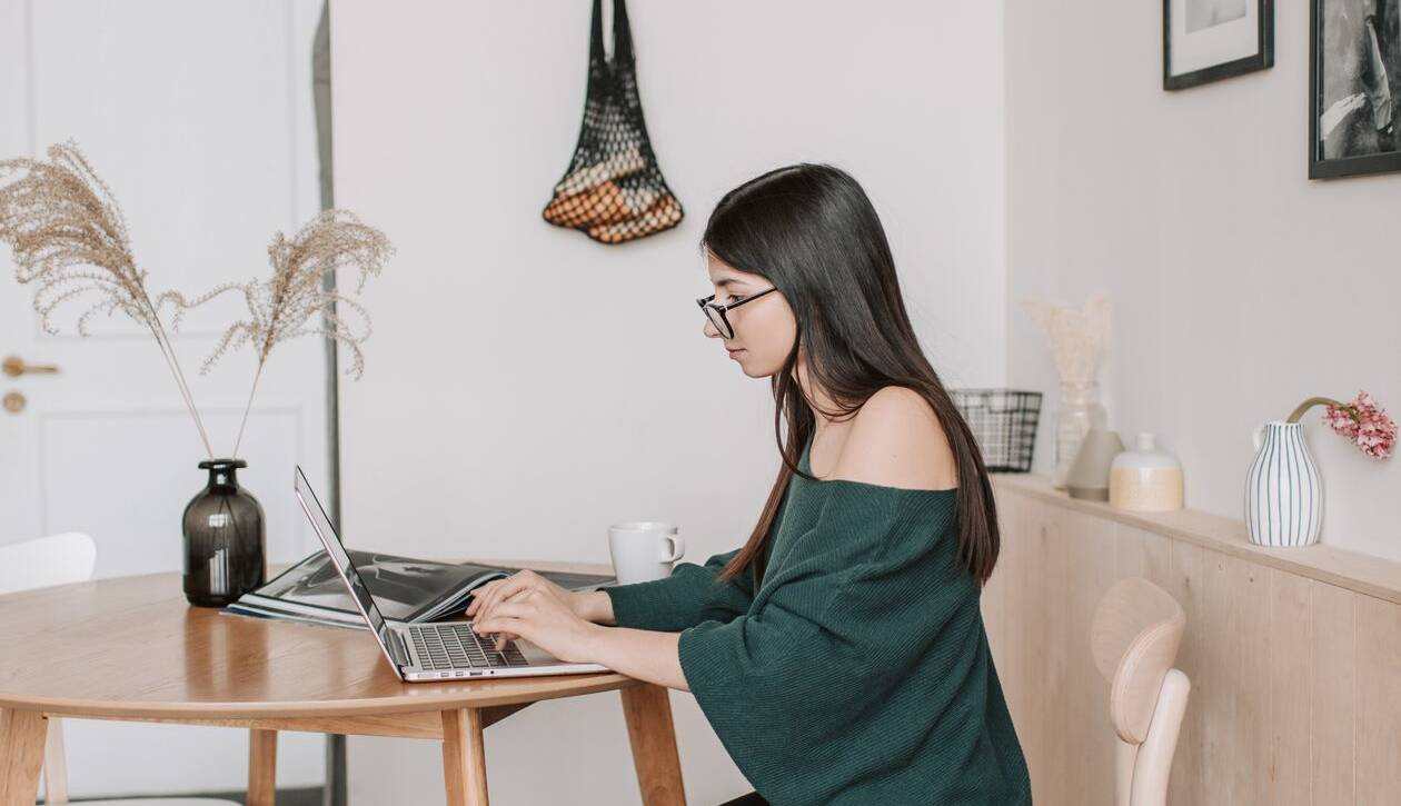 Remote administrative assistant organizing a small business owner's calendar and inbox