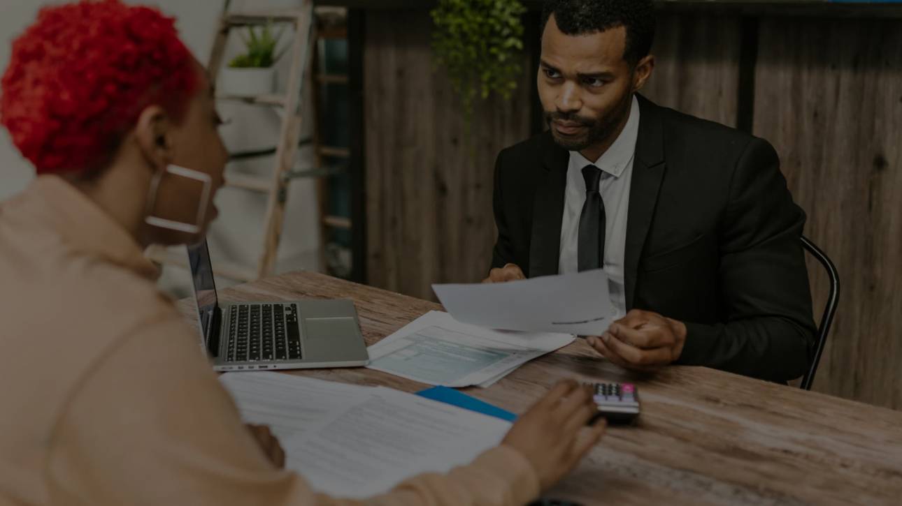 Small business owner discussing financing options with a bank advisor