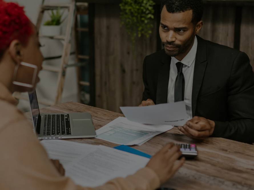 Small business owner discussing financing options with a bank advisor
